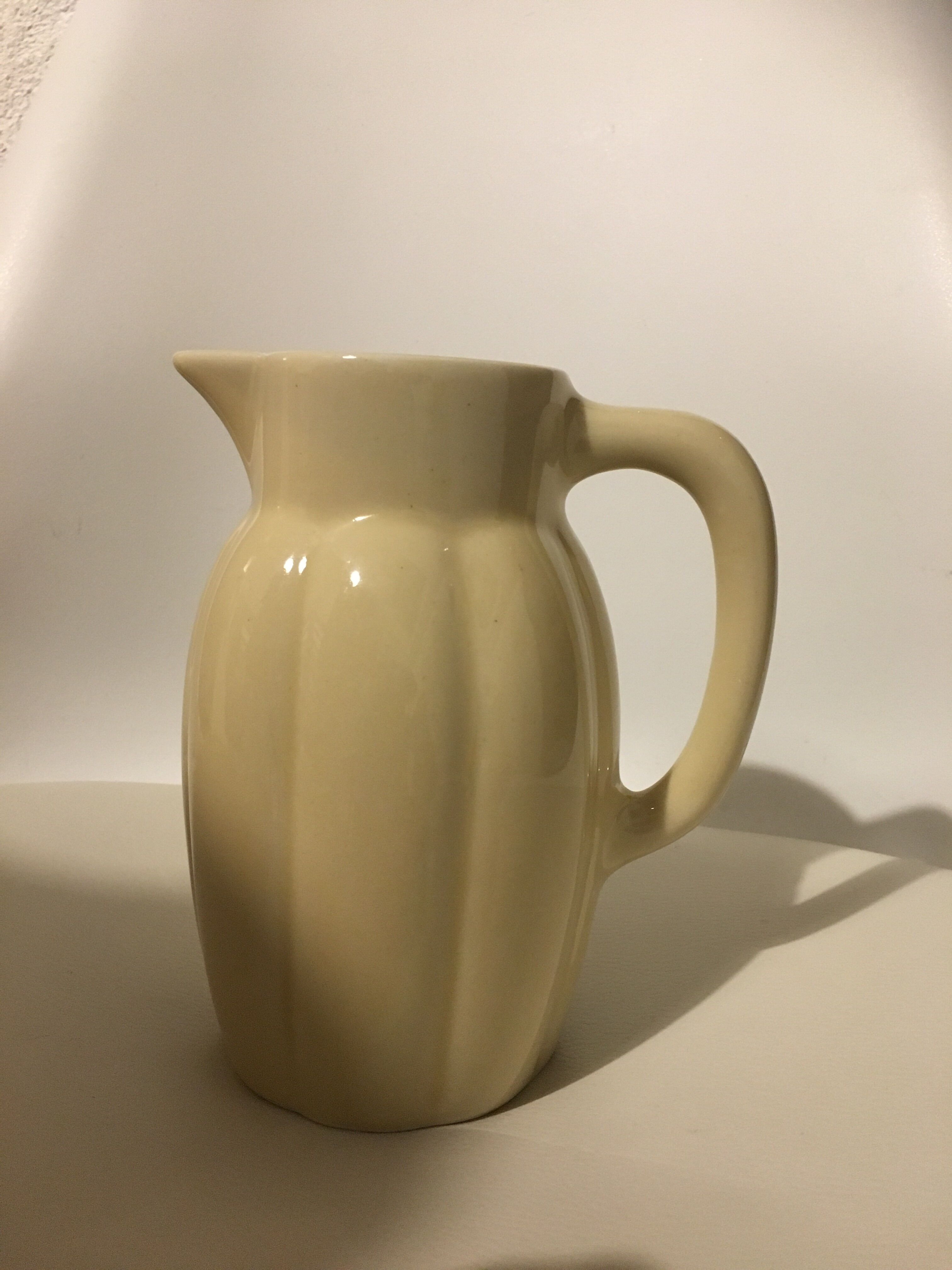 Cream color earthenware pitcher