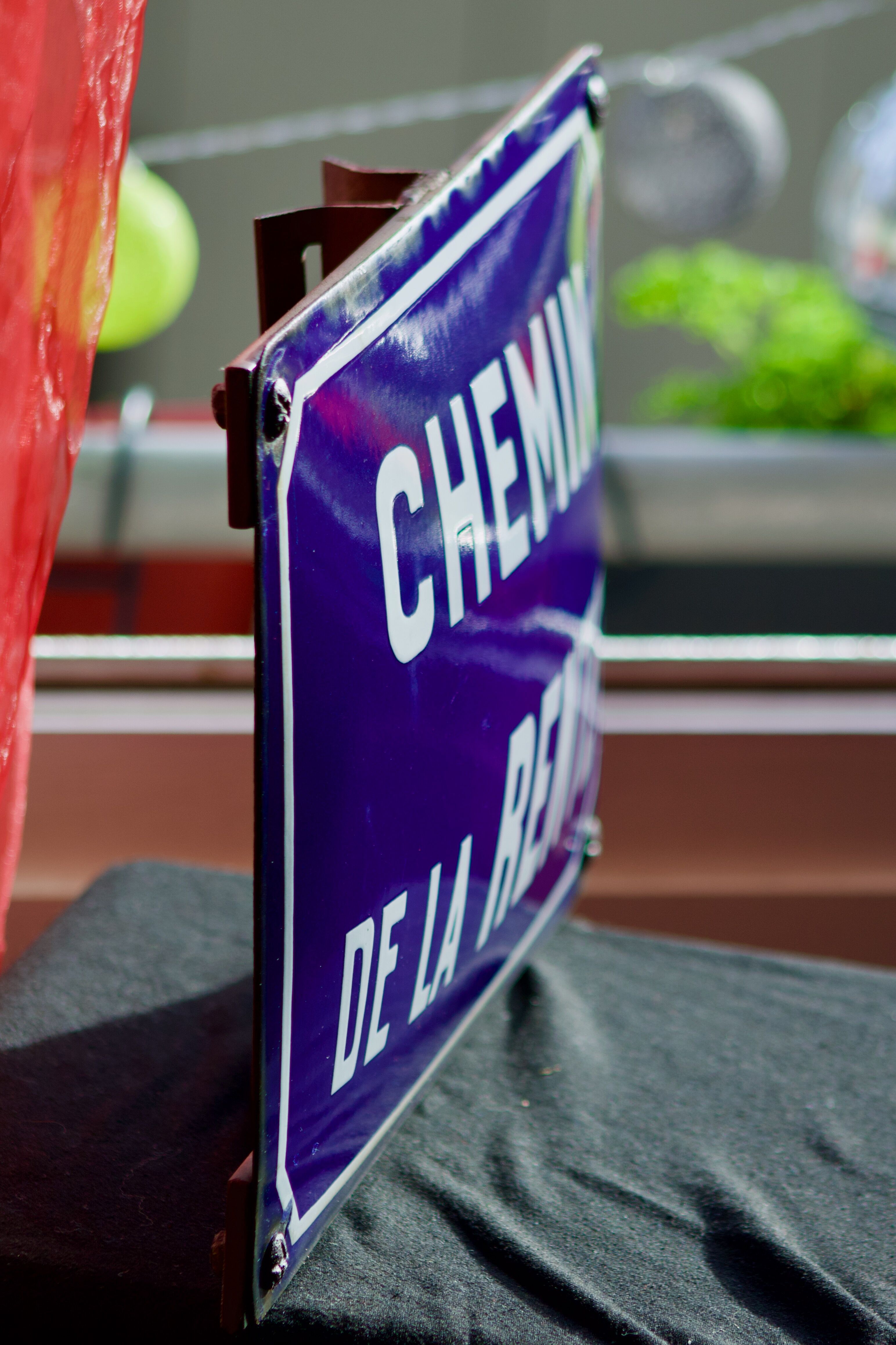 Old Enamelled and bulging "Chemin de la Rente" street plate, in perfect condition, on its cast iron support