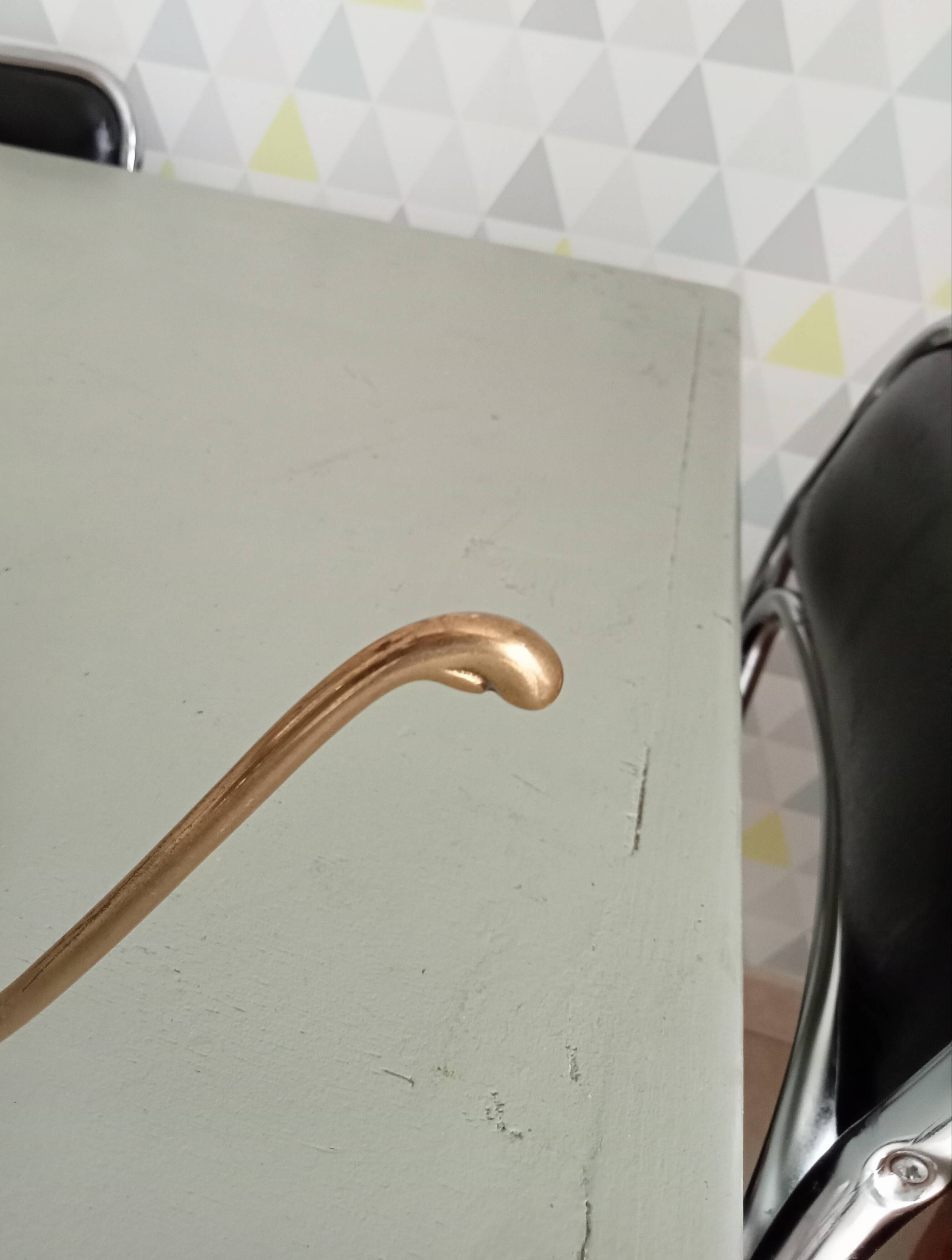 Old coat hook in solid golden brass