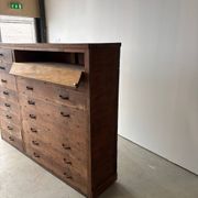 Large wooden workshop cabinet with 16 drawers, antique from the early 1900s.