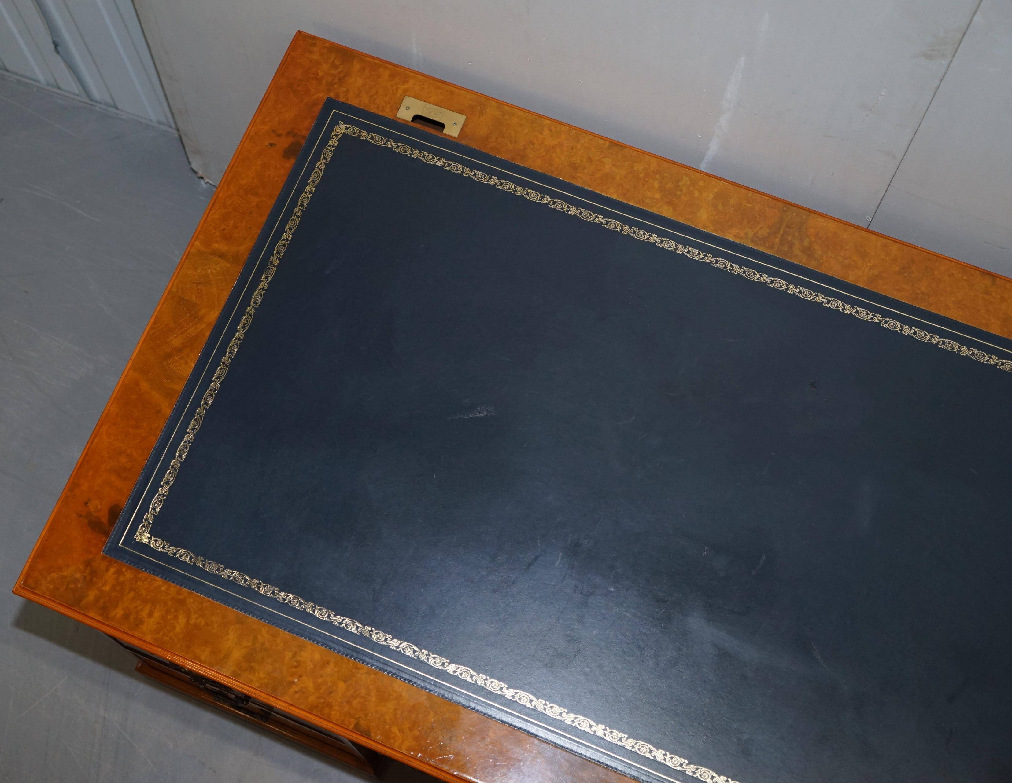 Partner desk in burr walnut designed to conceal computer equipment.