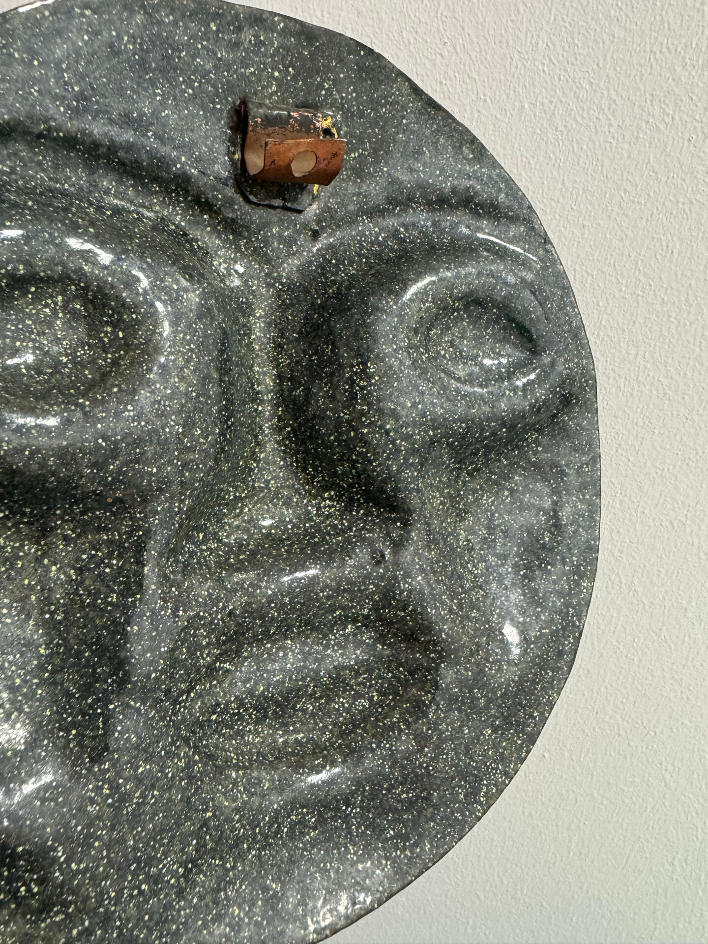 Sculpture face in embossed enamelled brass from the 1960s.