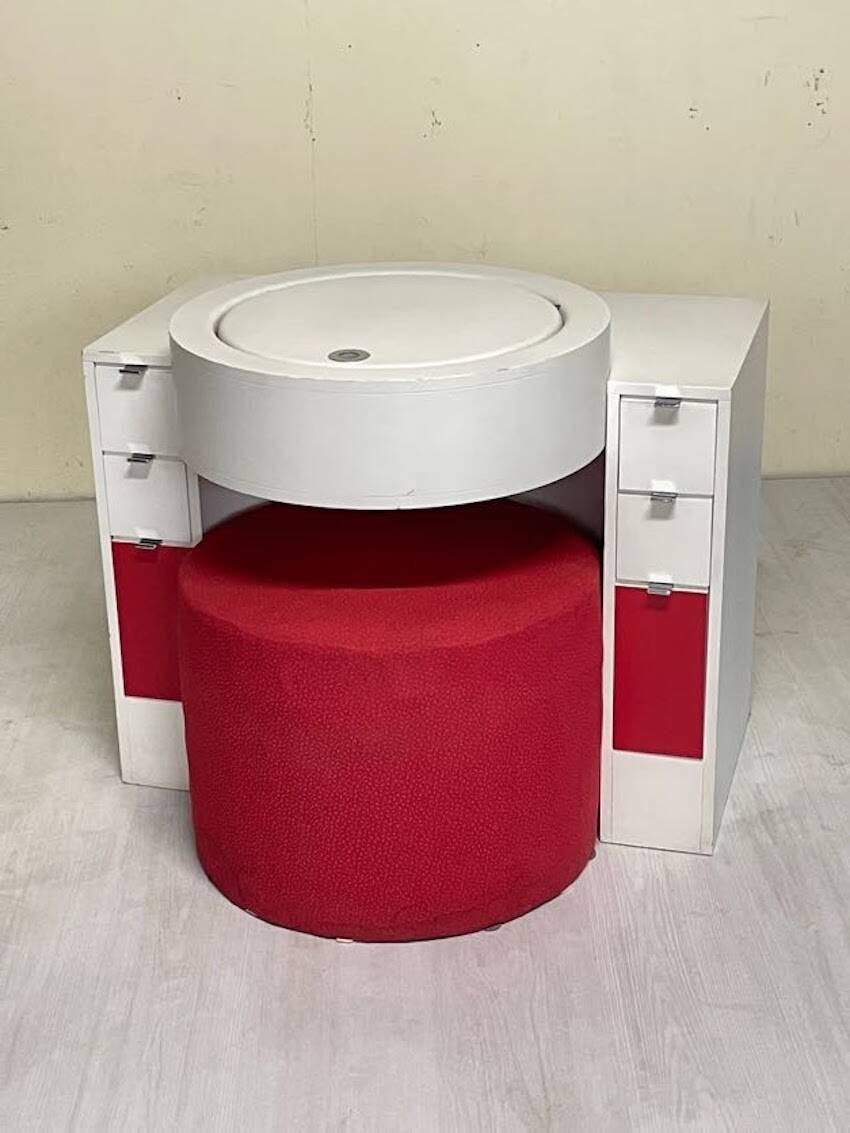 Bathroom toilet with a 70s pouf.