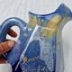 Old flamed ceramic jug. Very beautiful shades of blue, 6 sides.