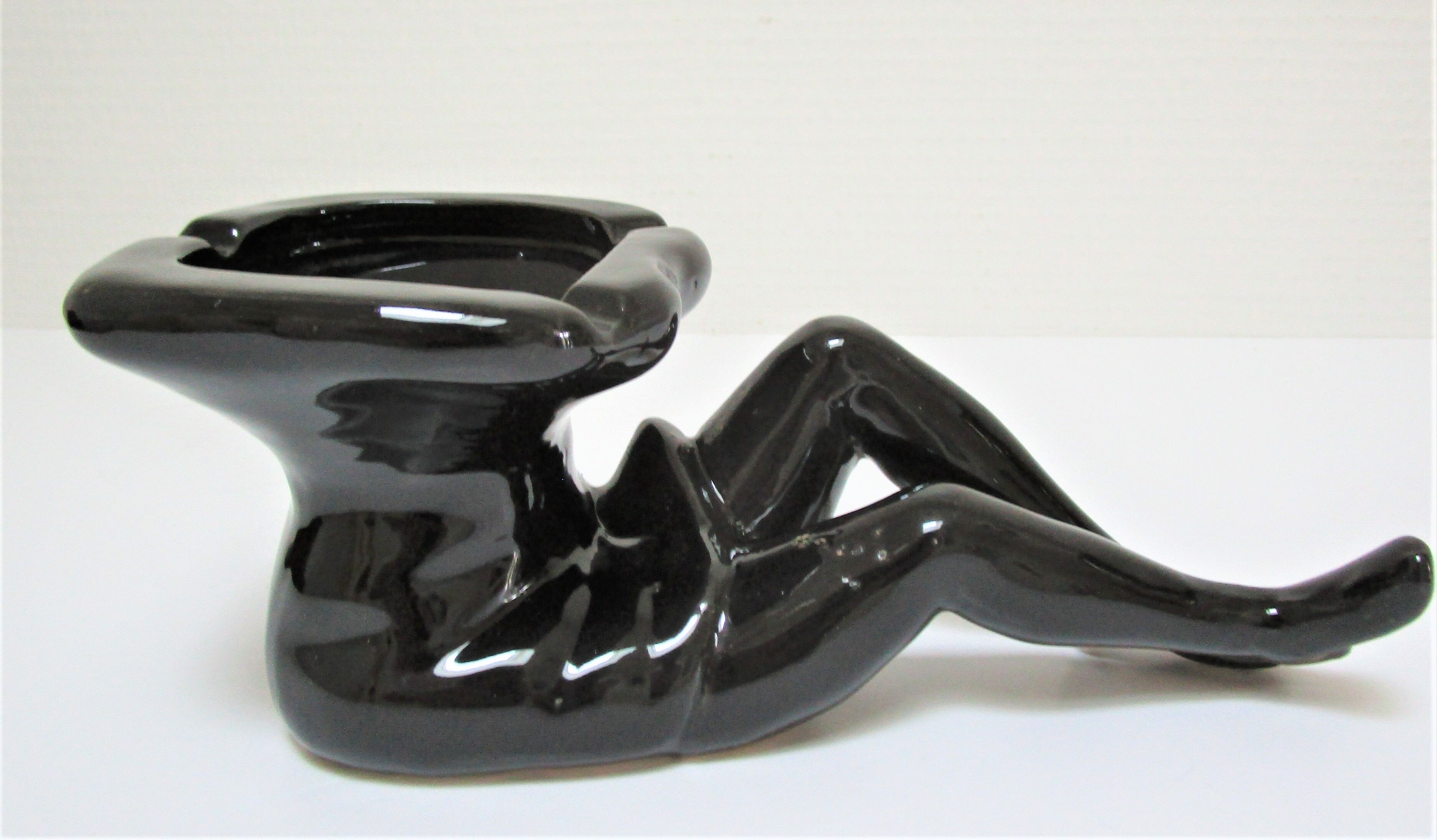 Anthropomorphic ashtray legs ceramic black design 80s