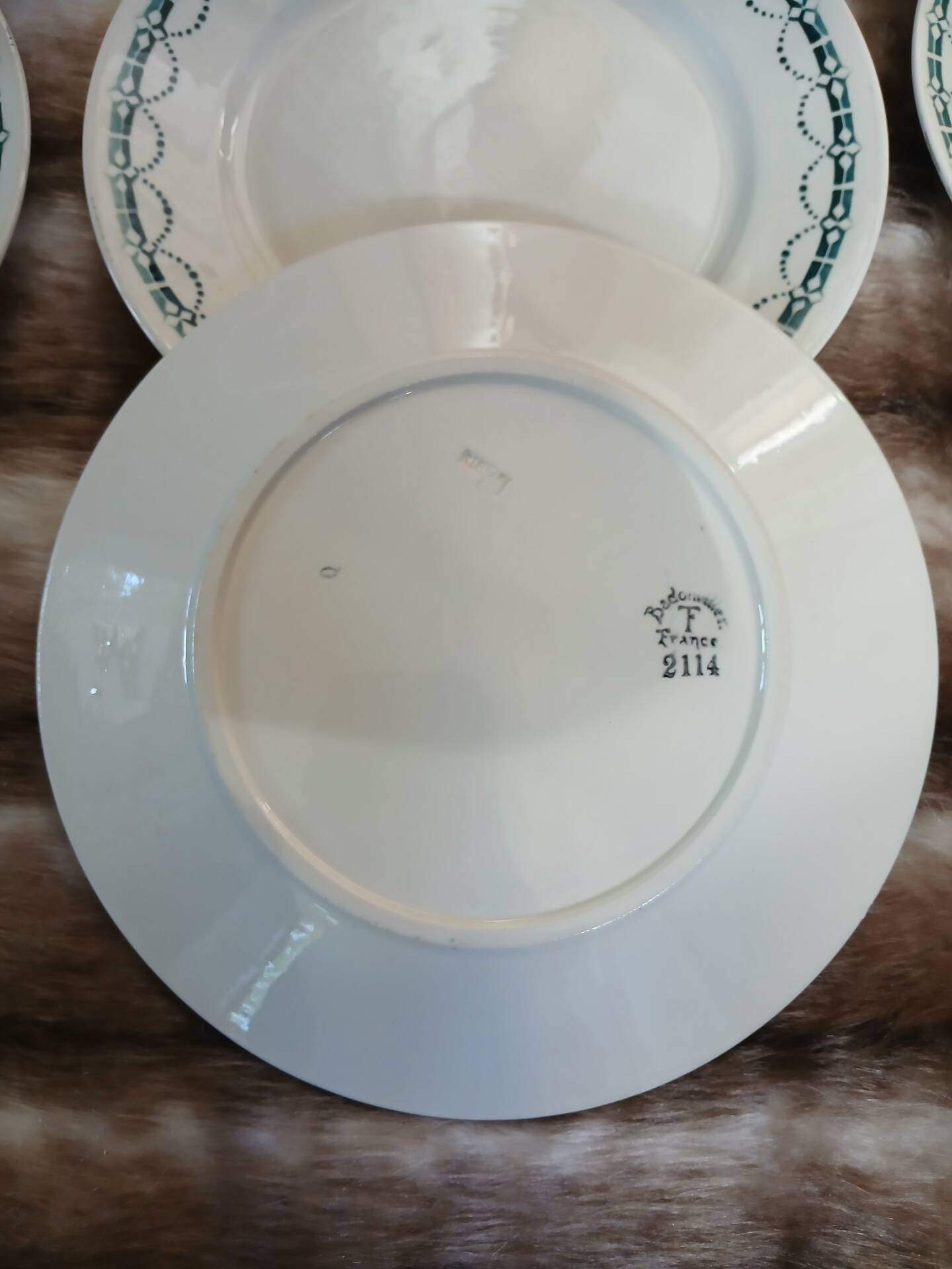 12 flat plates in ironstone from Badonviller