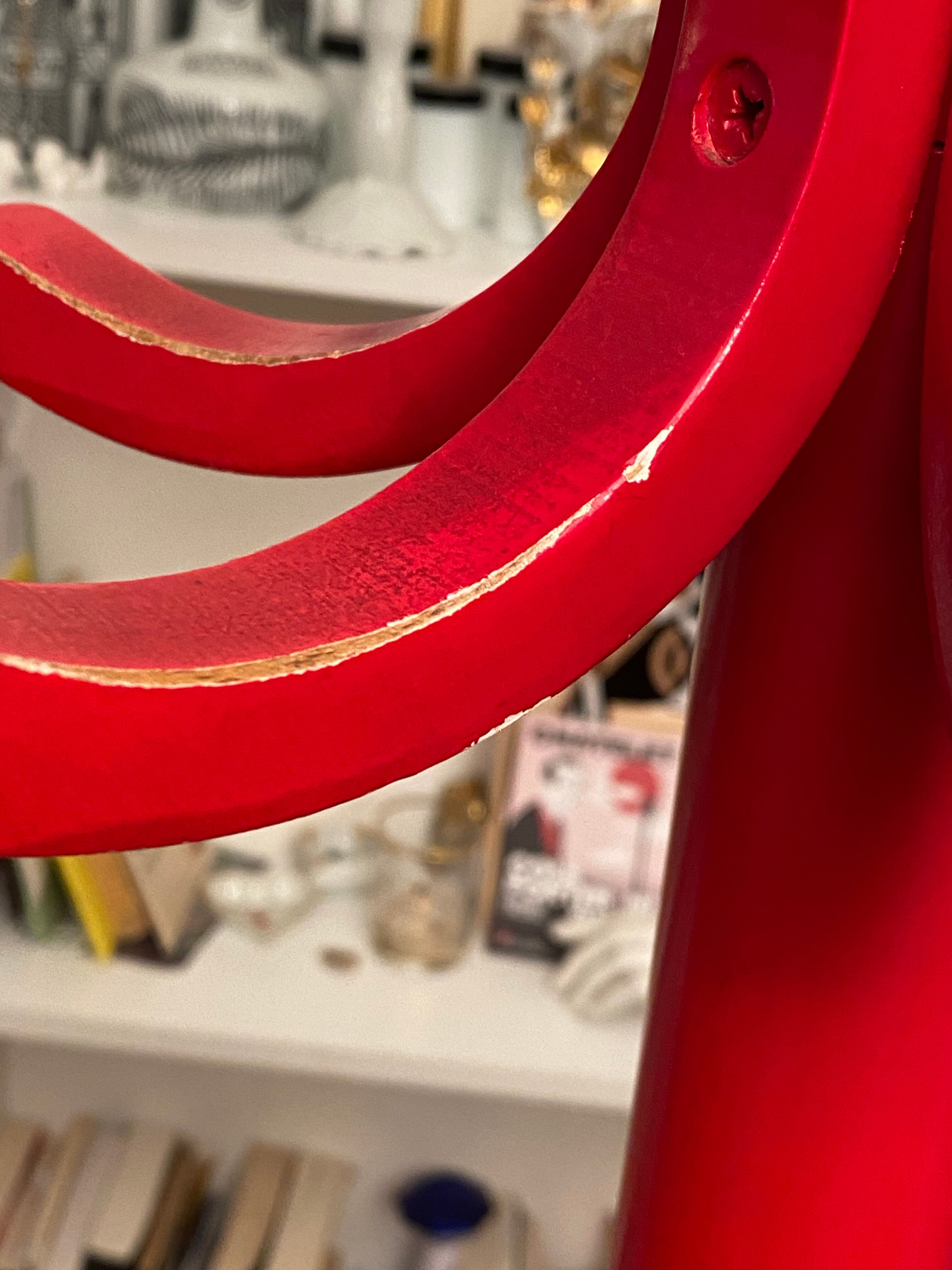 Red Baumann parrot coat rack