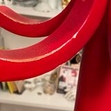 Red Baumann parrot coat rack