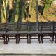 6 solid wood dining chairs with grey woven wool seats.