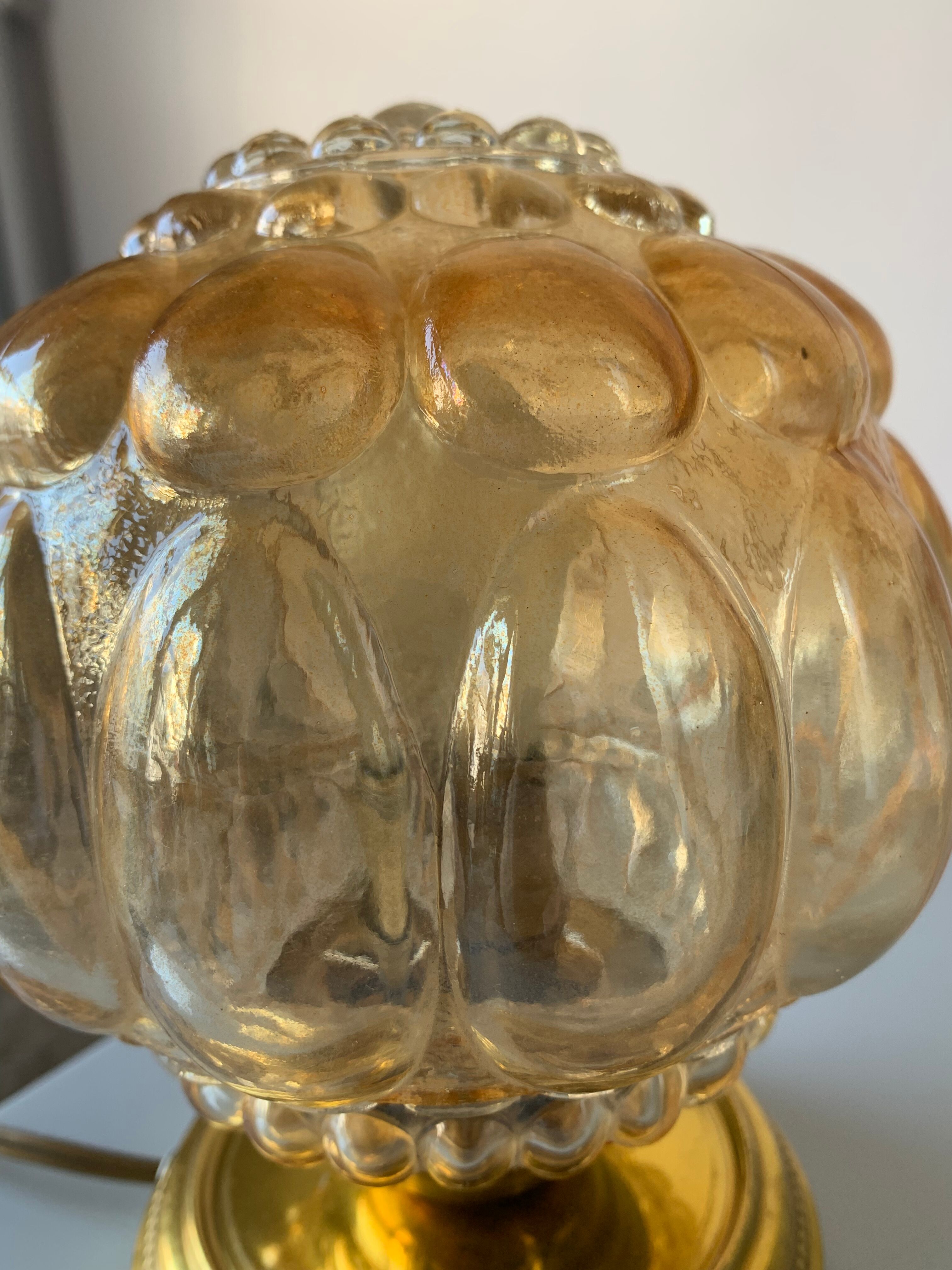 Old vintage table lamp made of amber molded glass