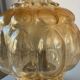 Old vintage table lamp made of amber molded glass