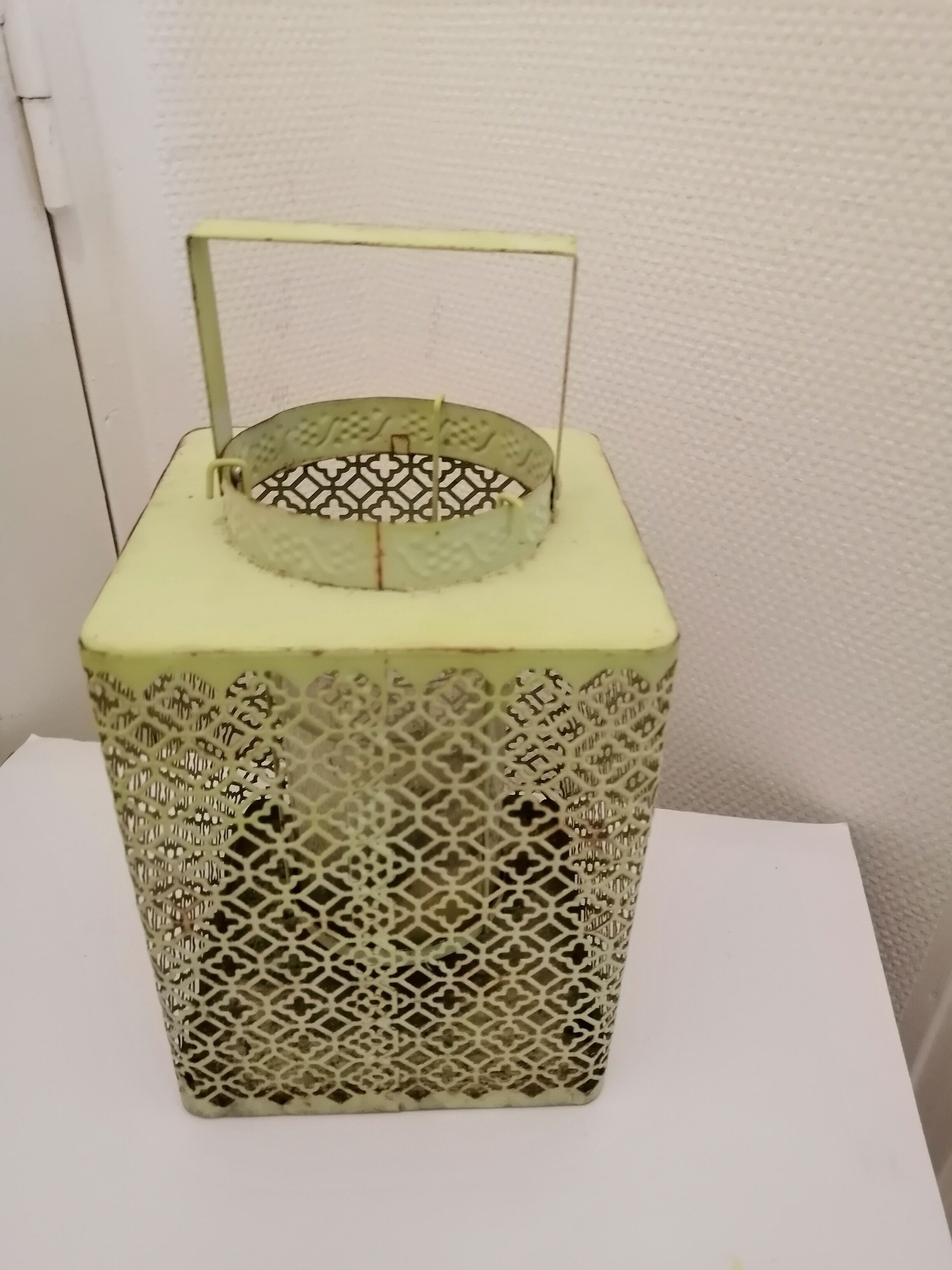 Metal lanterns with garden candles