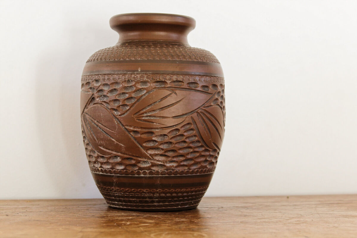 Carved terracotta vase, signed