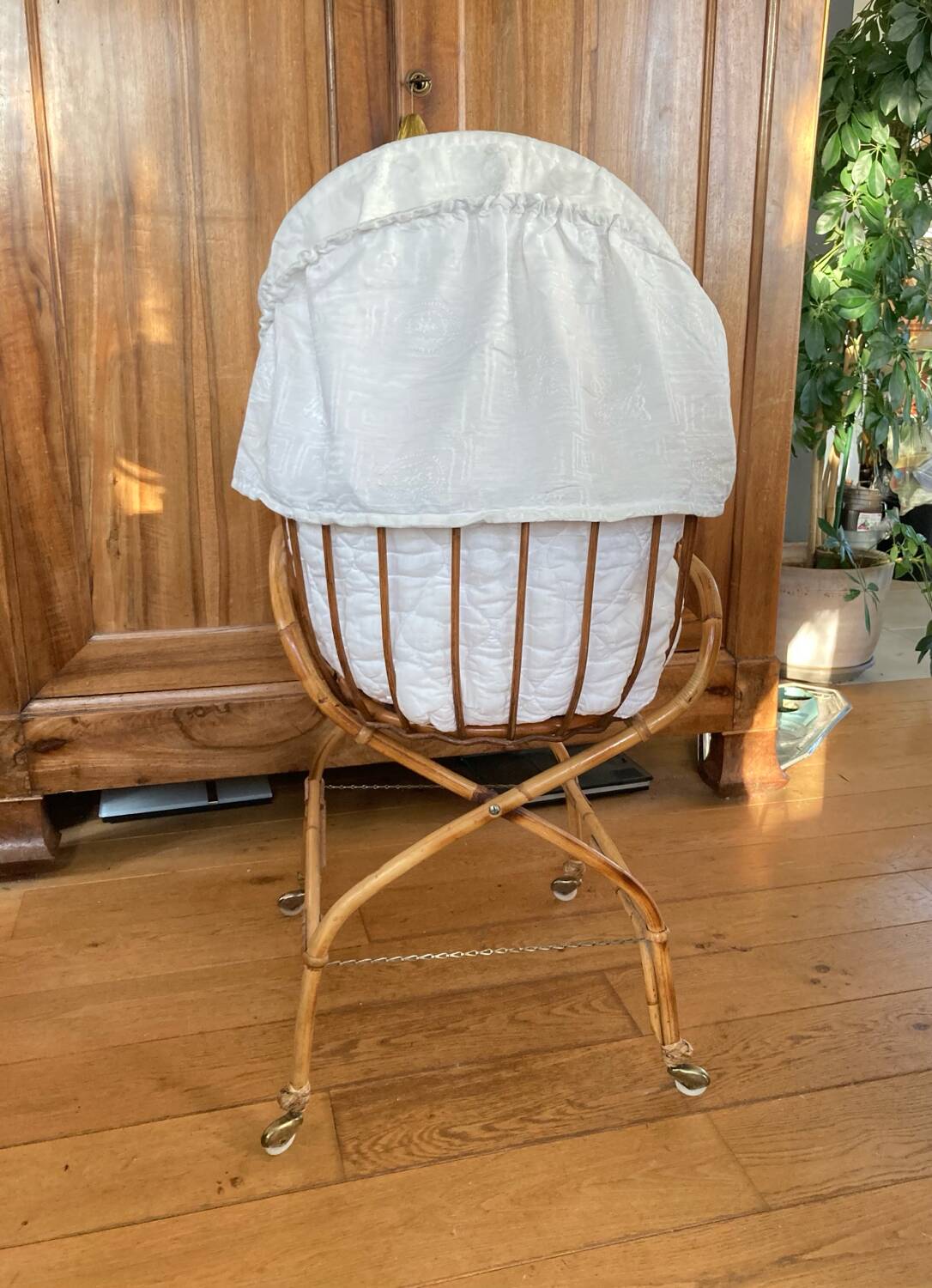 Bamboo, rattan, wicker cradle bassinet from the 1960s with a foldable support.