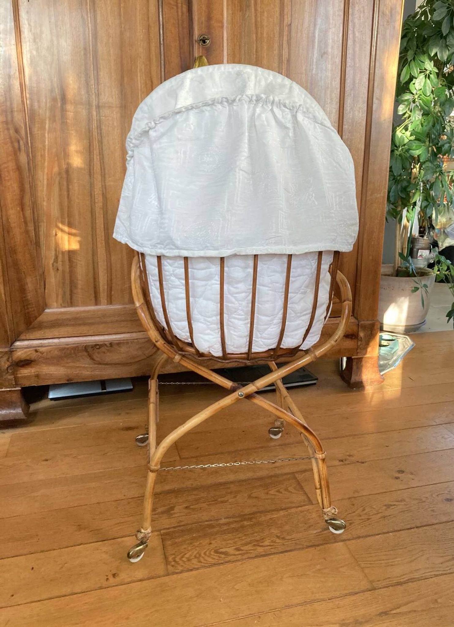Bamboo, rattan, wicker cradle bassinet from the 1960s with a foldable support.