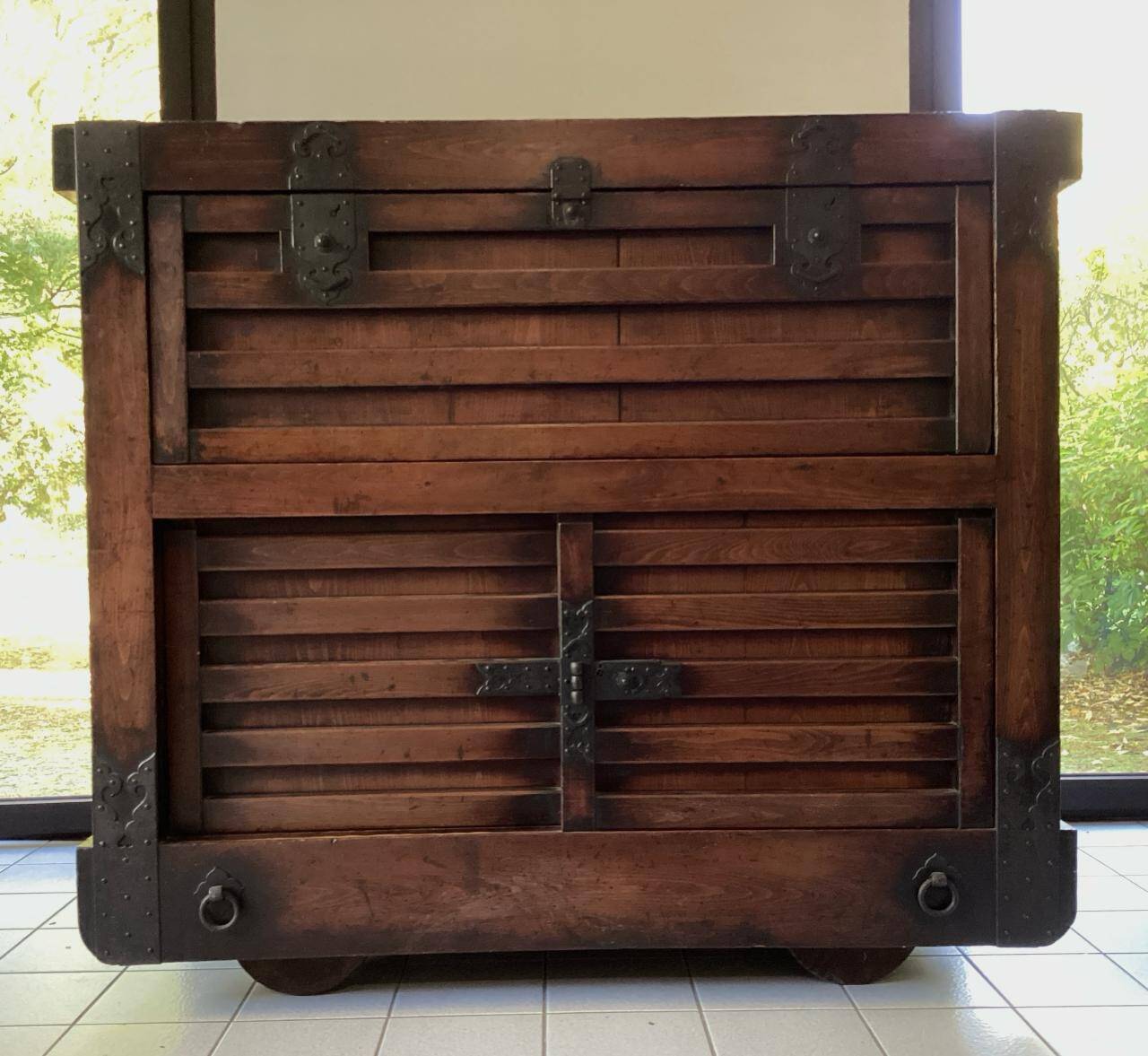 Japanese antique wooden chest with black fittings.