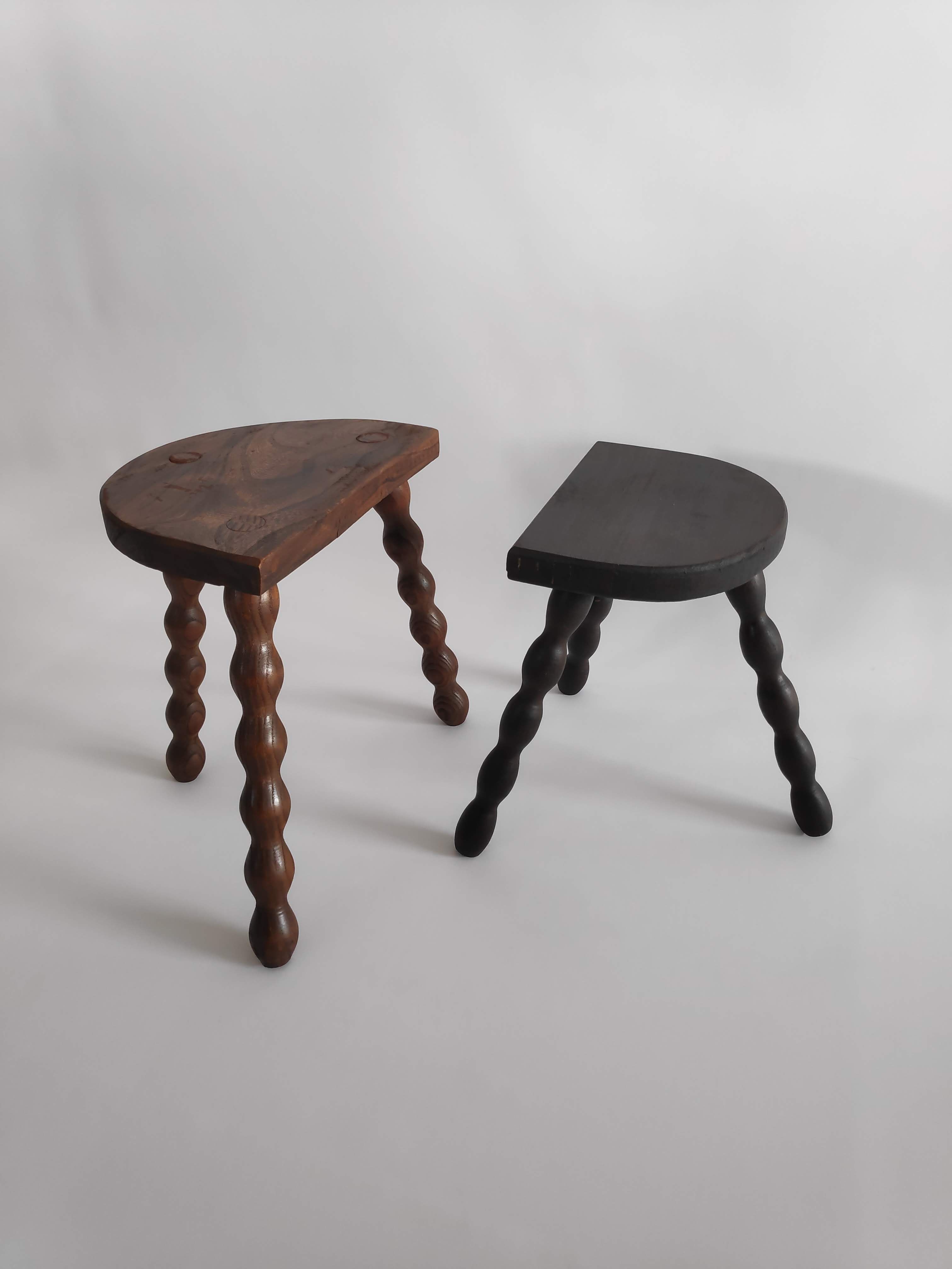 Pair of vintage tripod stools with turned wooden feet