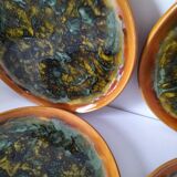 Set of 4 flamed enamel plates in green and amber from the 60s-70s.