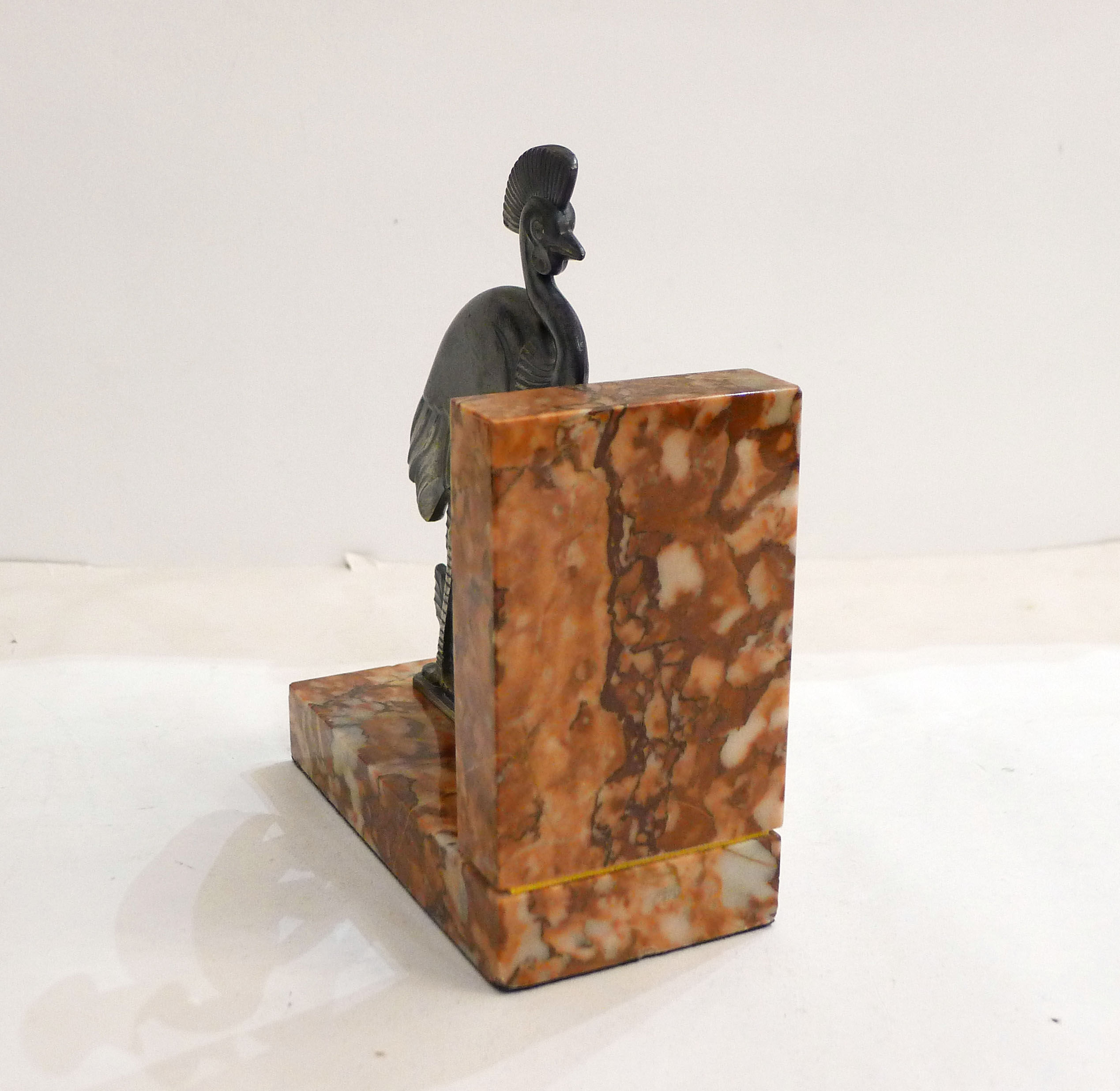 Art Deco bird bookend on marble