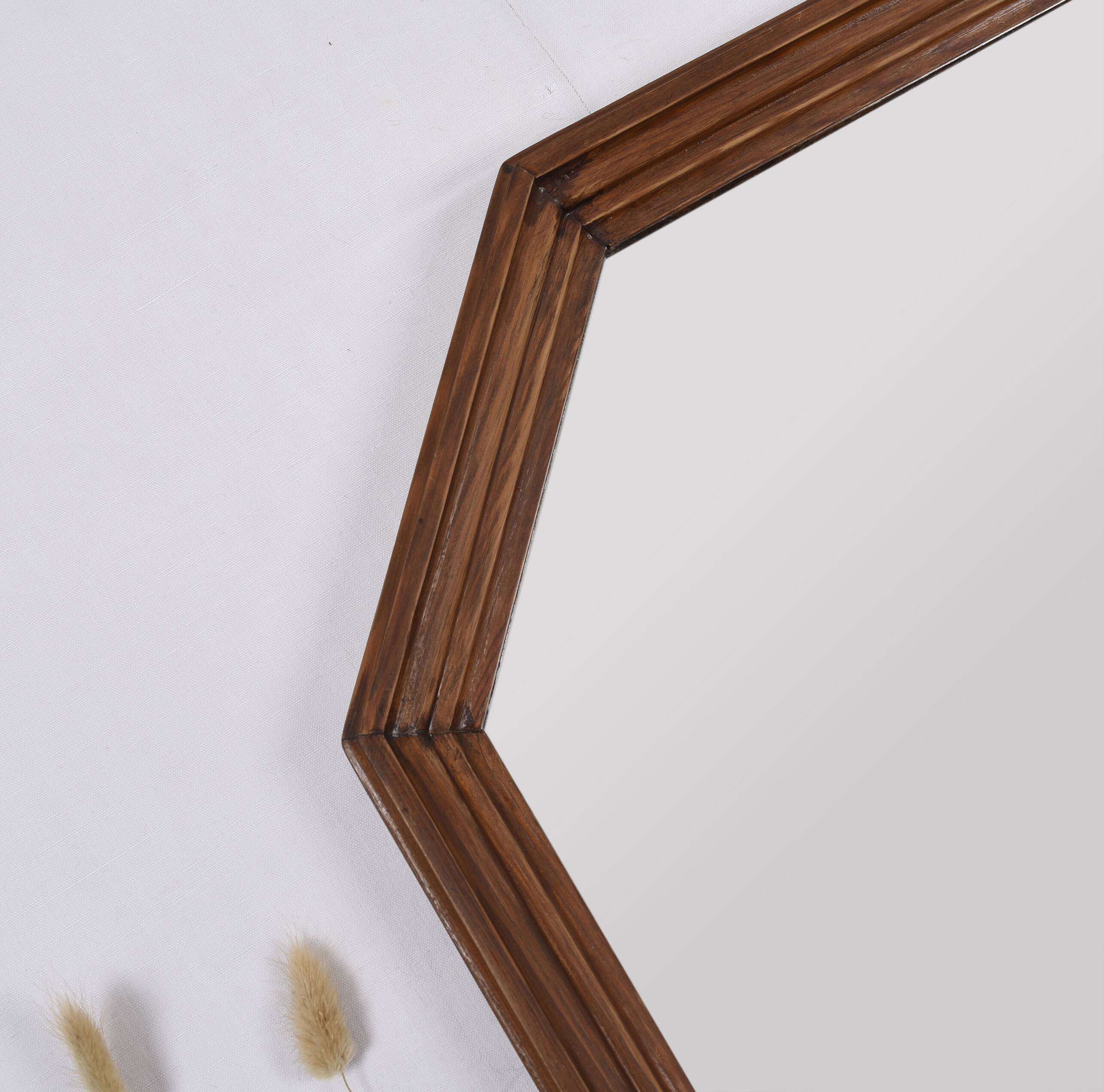 Old second-hand wooden mirror, octagonal shape.