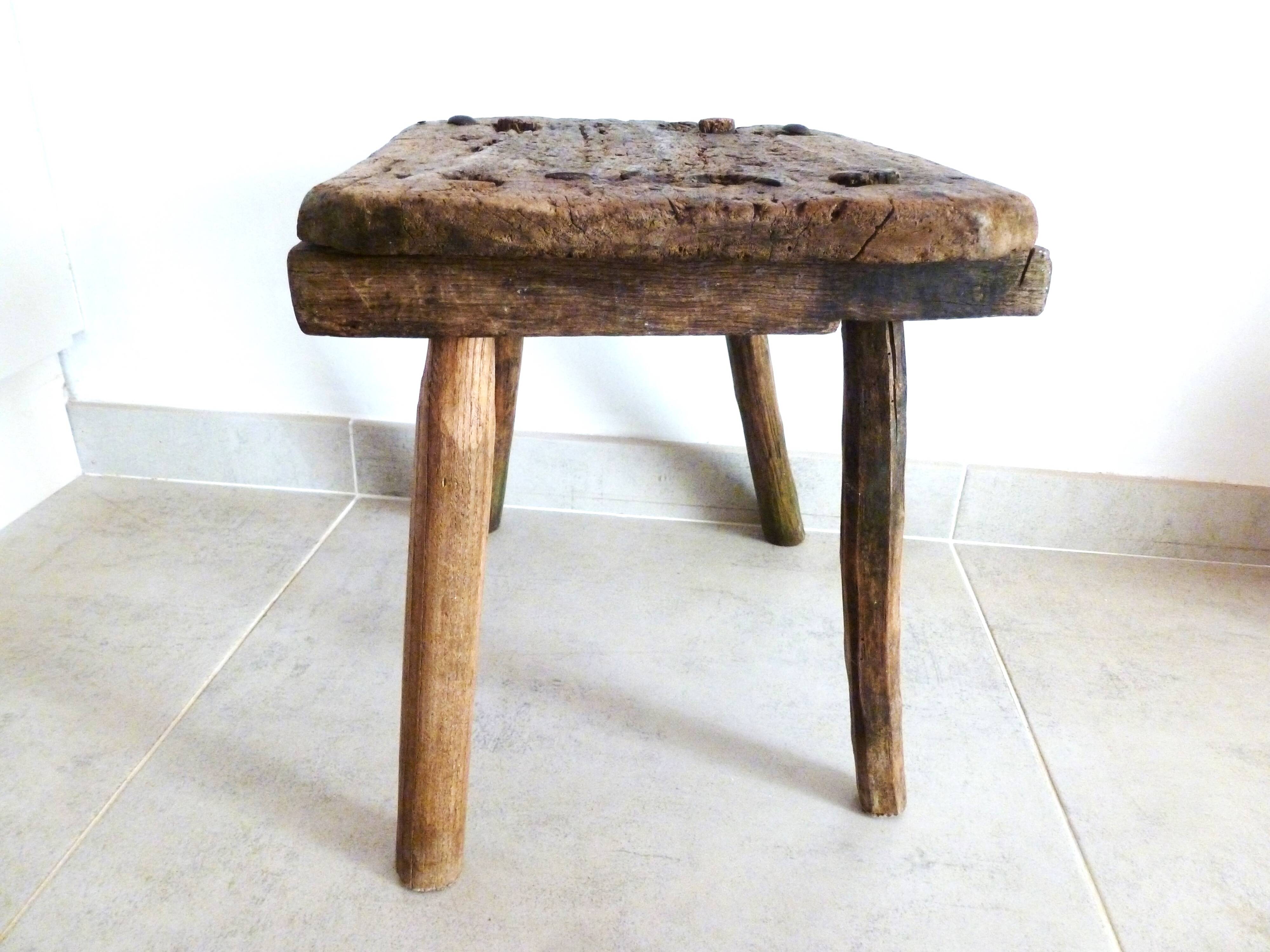 Old milking stool, old farm stool, primitive art.
