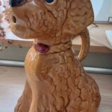 Ancient ceramic pitcher in the shape of a poodle.