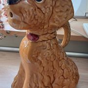 Ancient ceramic pitcher in the shape of a poodle.