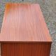 Chest of drawers from the 50s-60s in golden mahogany 4 drawers feet bobbin