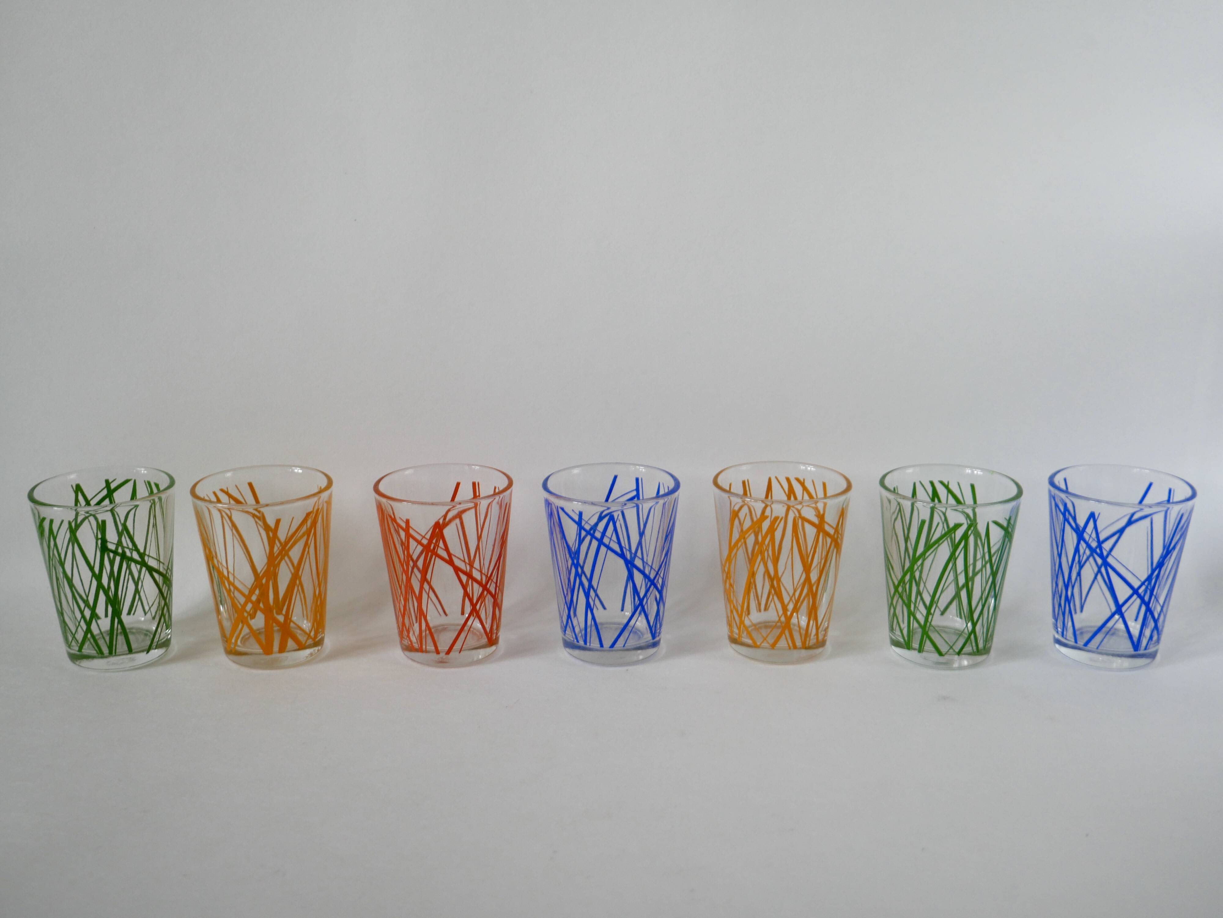 Colorful designer set composed of 7 liqueur glasses and a seventies 70s carafe