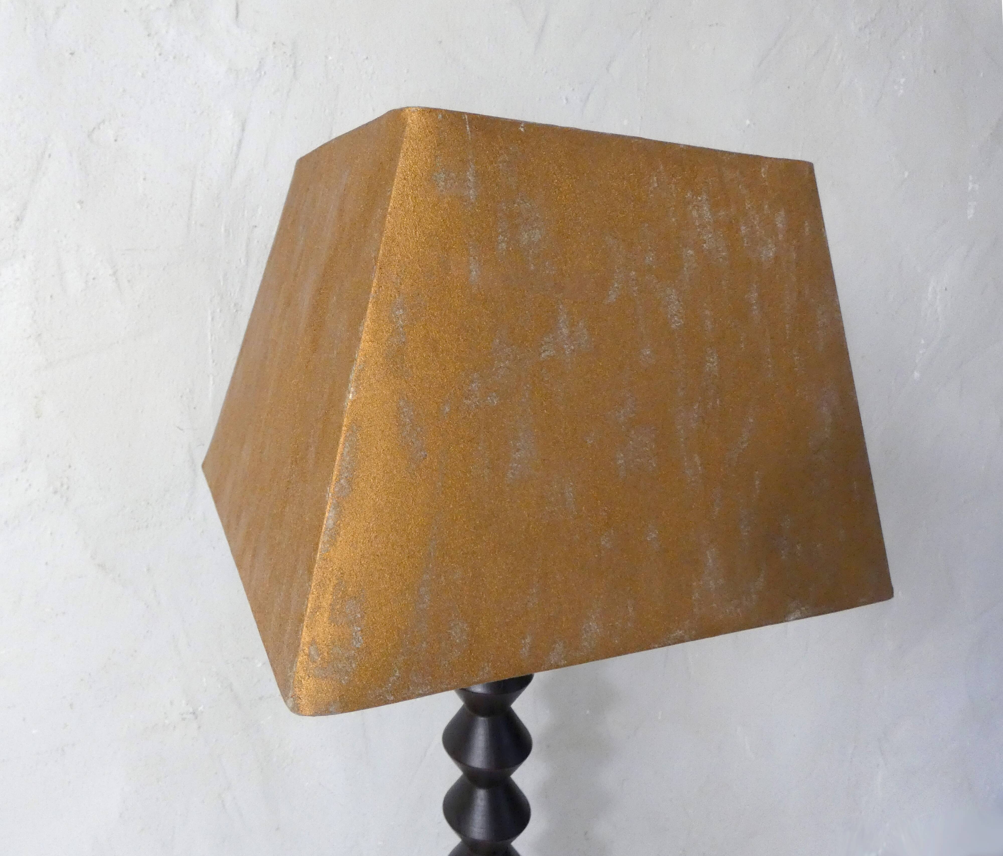 turned wooden lamp with spool base and vintage copper shade