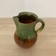 Green and brown ceramic pitcher