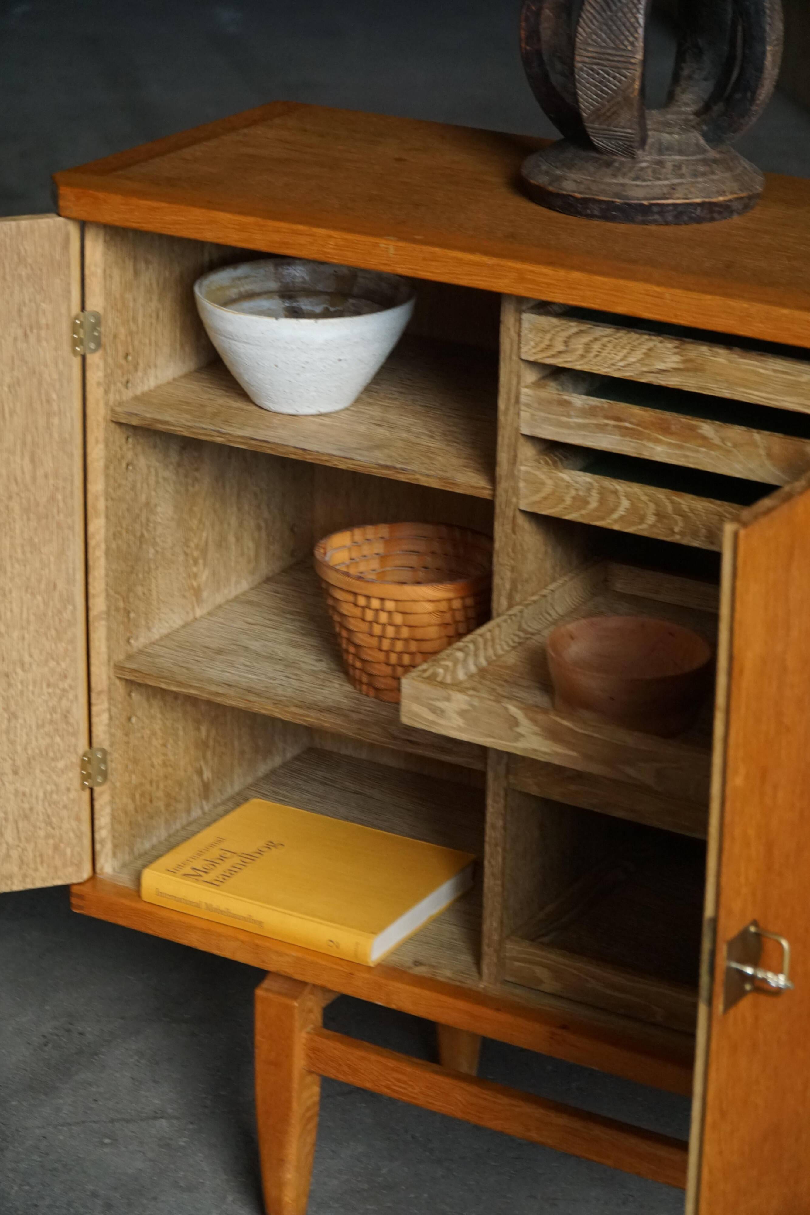 Oak and brass buffet by Henning Kjærnulf, Mid-century modern Danish, 1960s.
