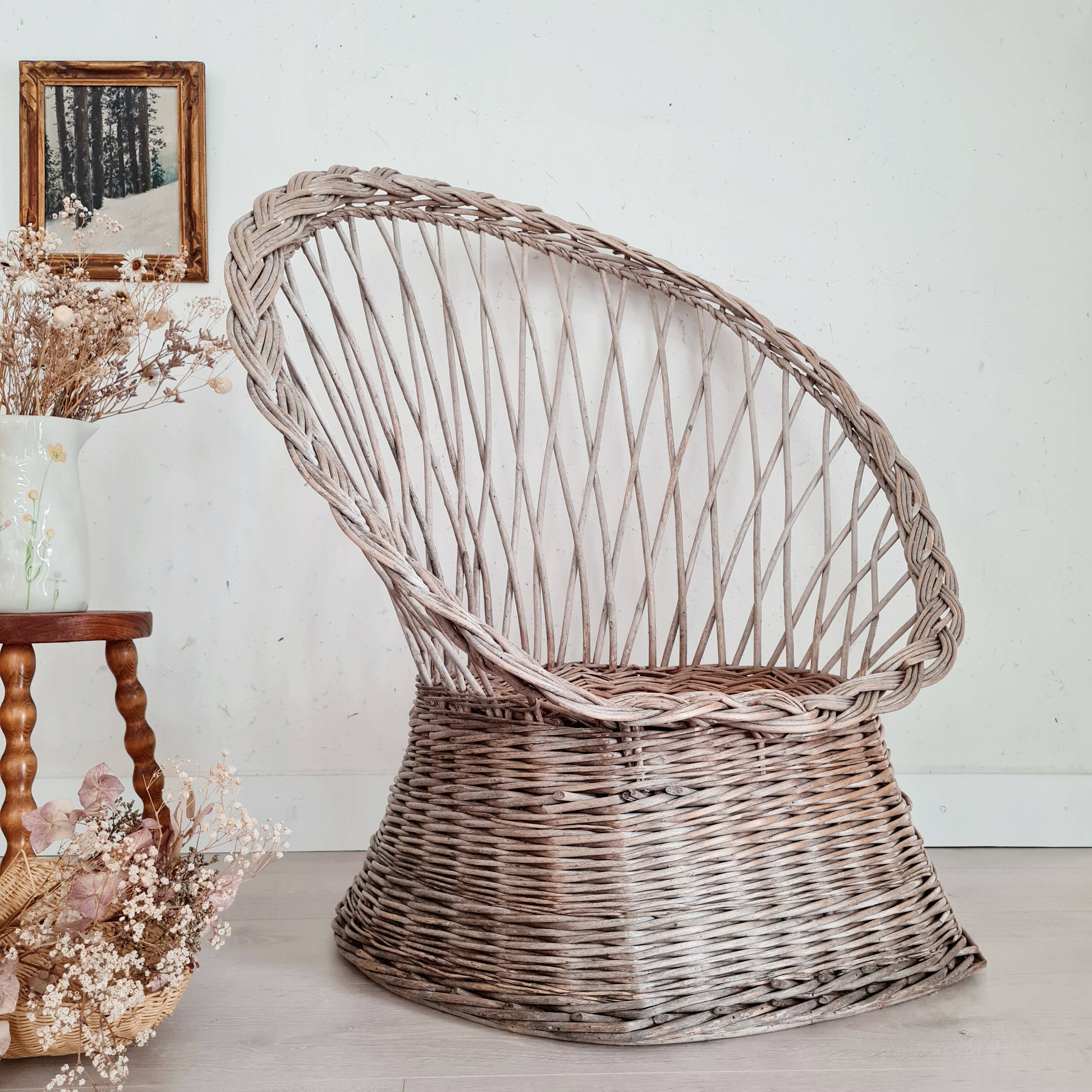 Antique armchair in gray woven wicker