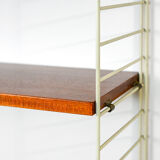 'string' bookcase with metal frame