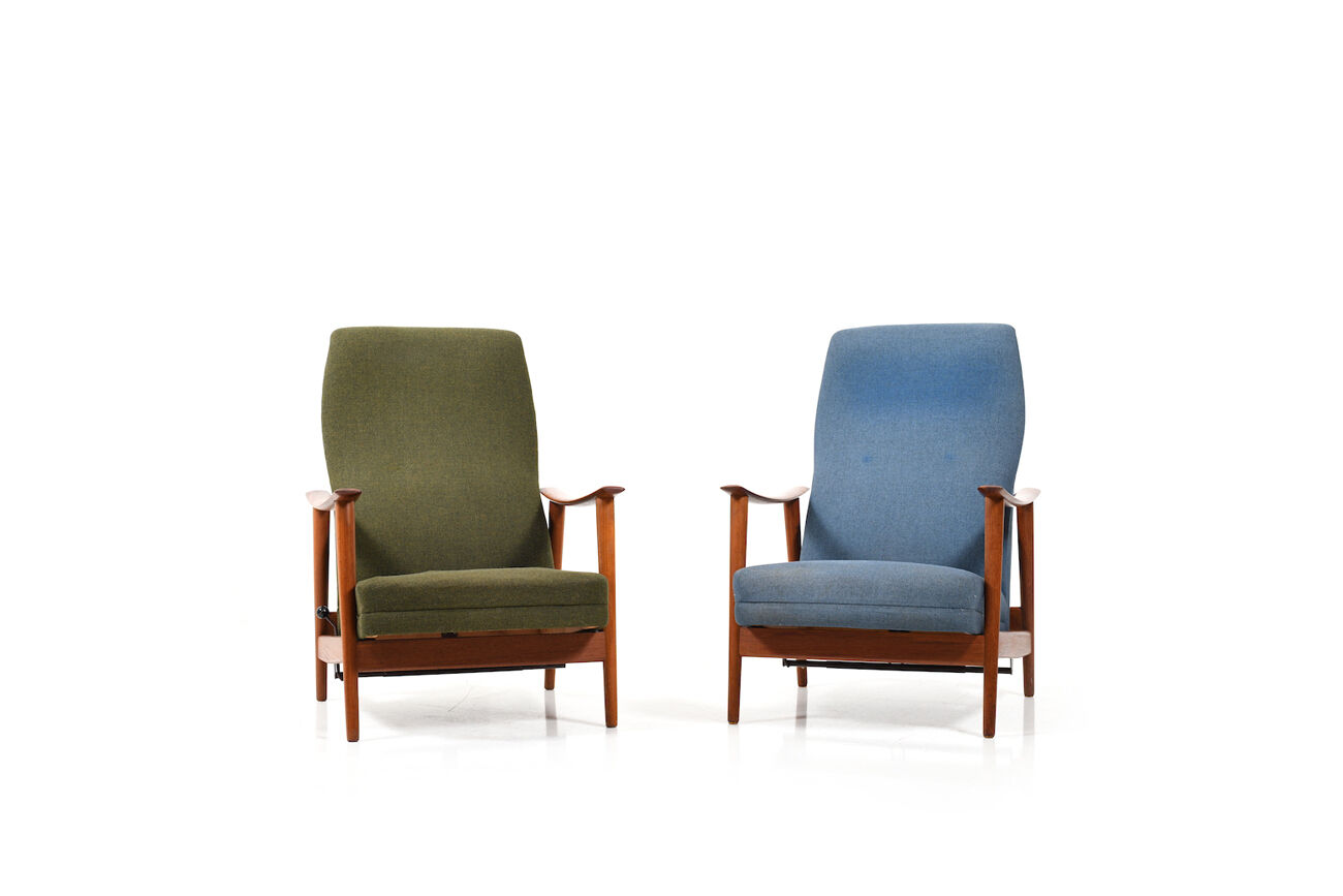 Pair of mid century Danish reclining lounge chairs in teak