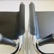 Pair of vintage chrome and black faux leather armchairs