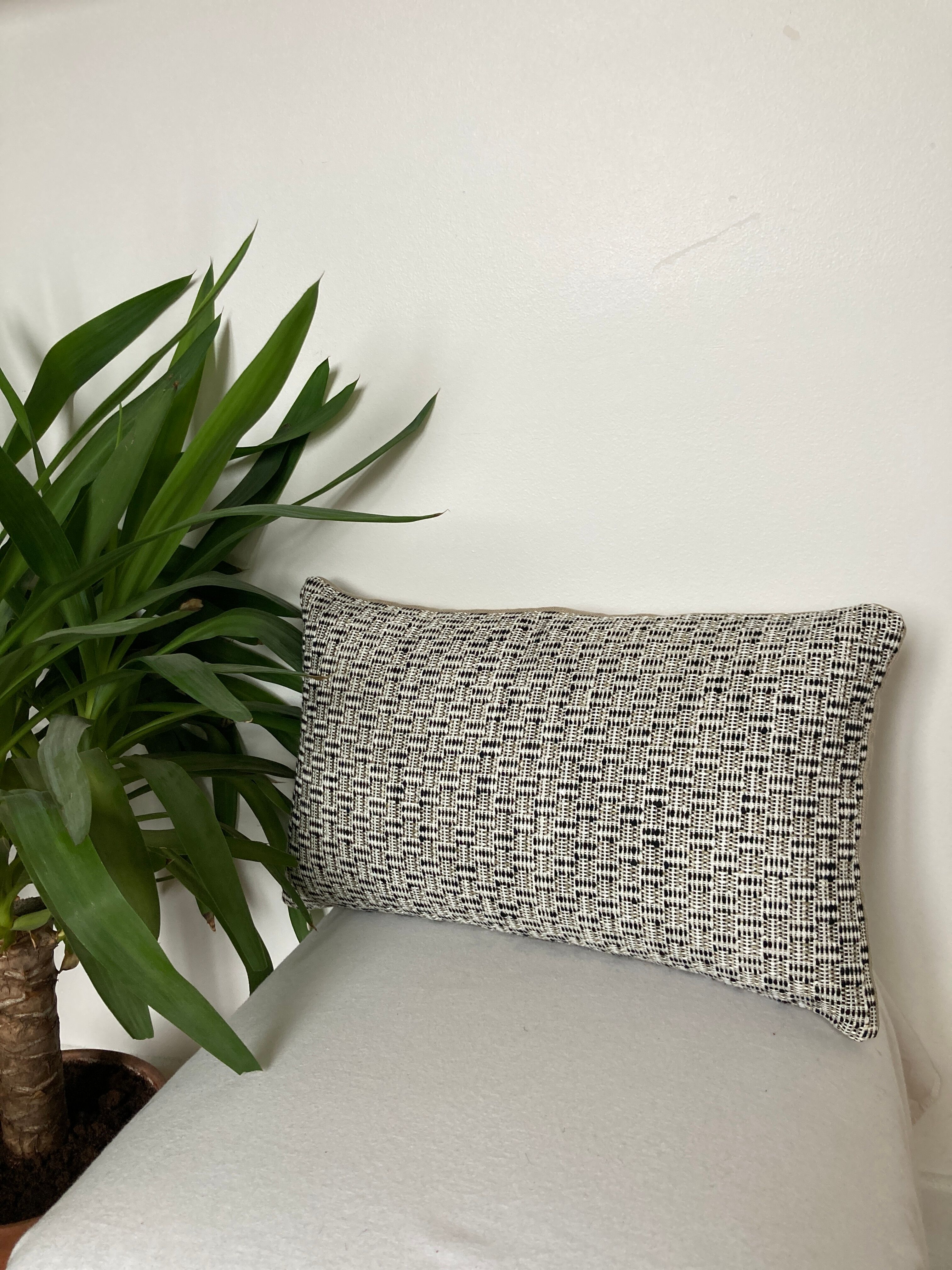 Bi-sided cushion beige black white pattern