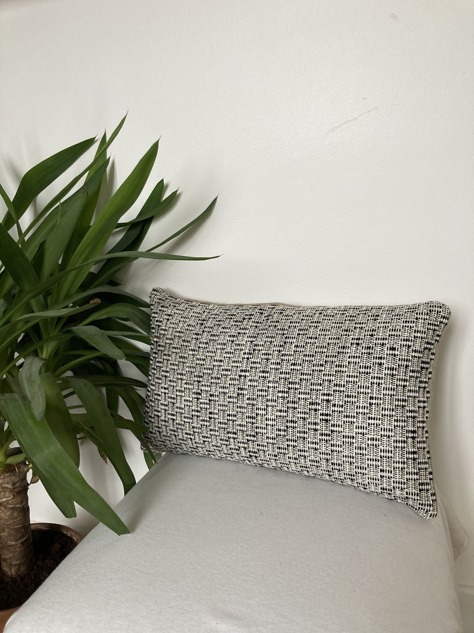 Bi-sided cushion beige black white pattern