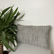 Bi-sided cushion beige black white pattern