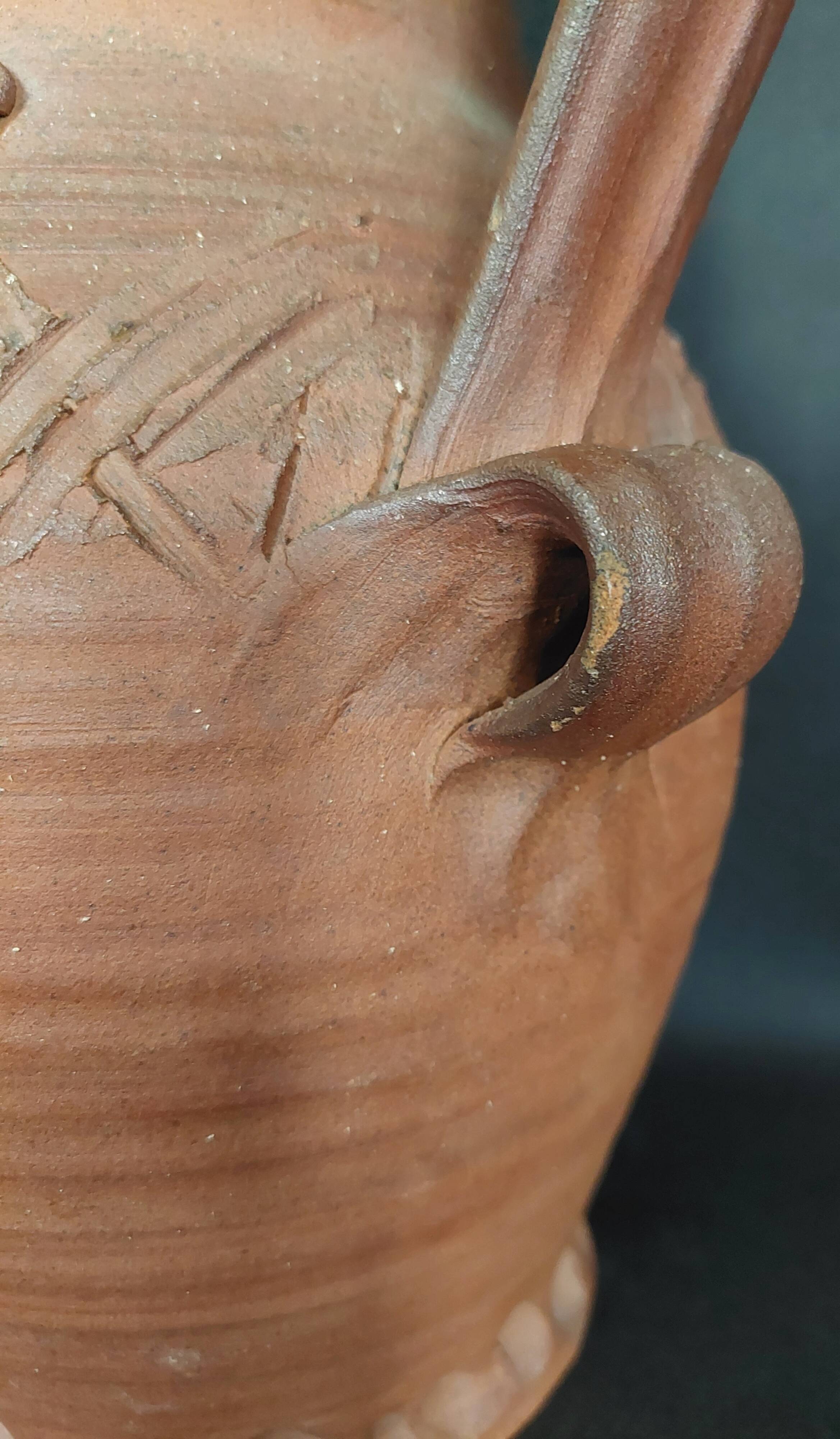 Vintage pitcher with a signature to identify.