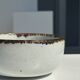 Small white glazed ceramic bowl black edges