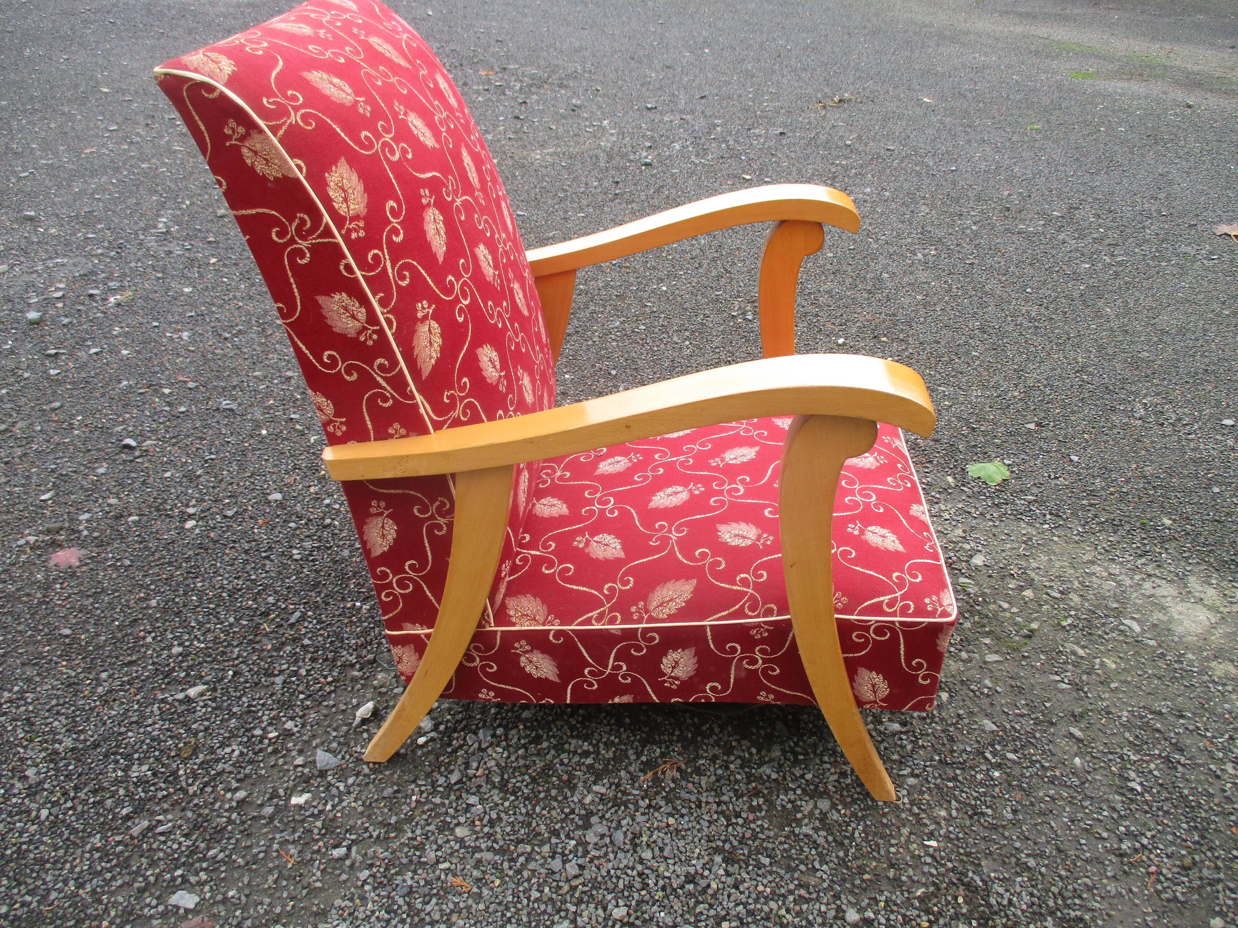 Scandinavian armchair in wood and red fabric