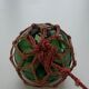 Globe, green glass float and vintage rope