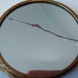 Old mirror facing hand