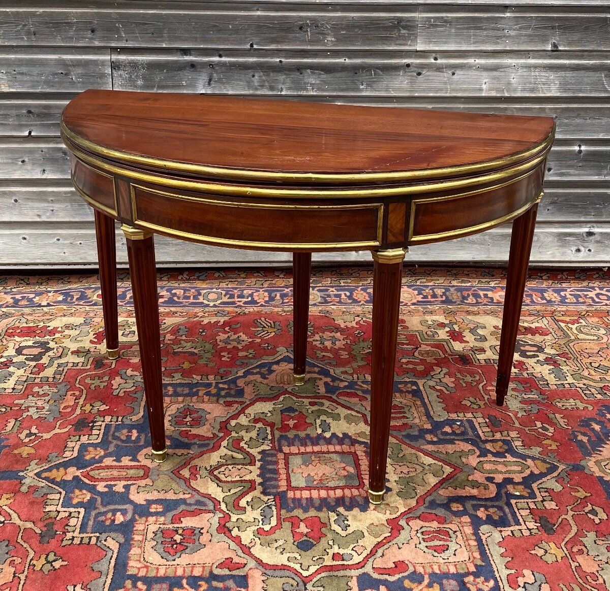 Half moon table in mahogany era Louis XVI XVIII th century