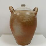 Ancient jar in varnished sandstone