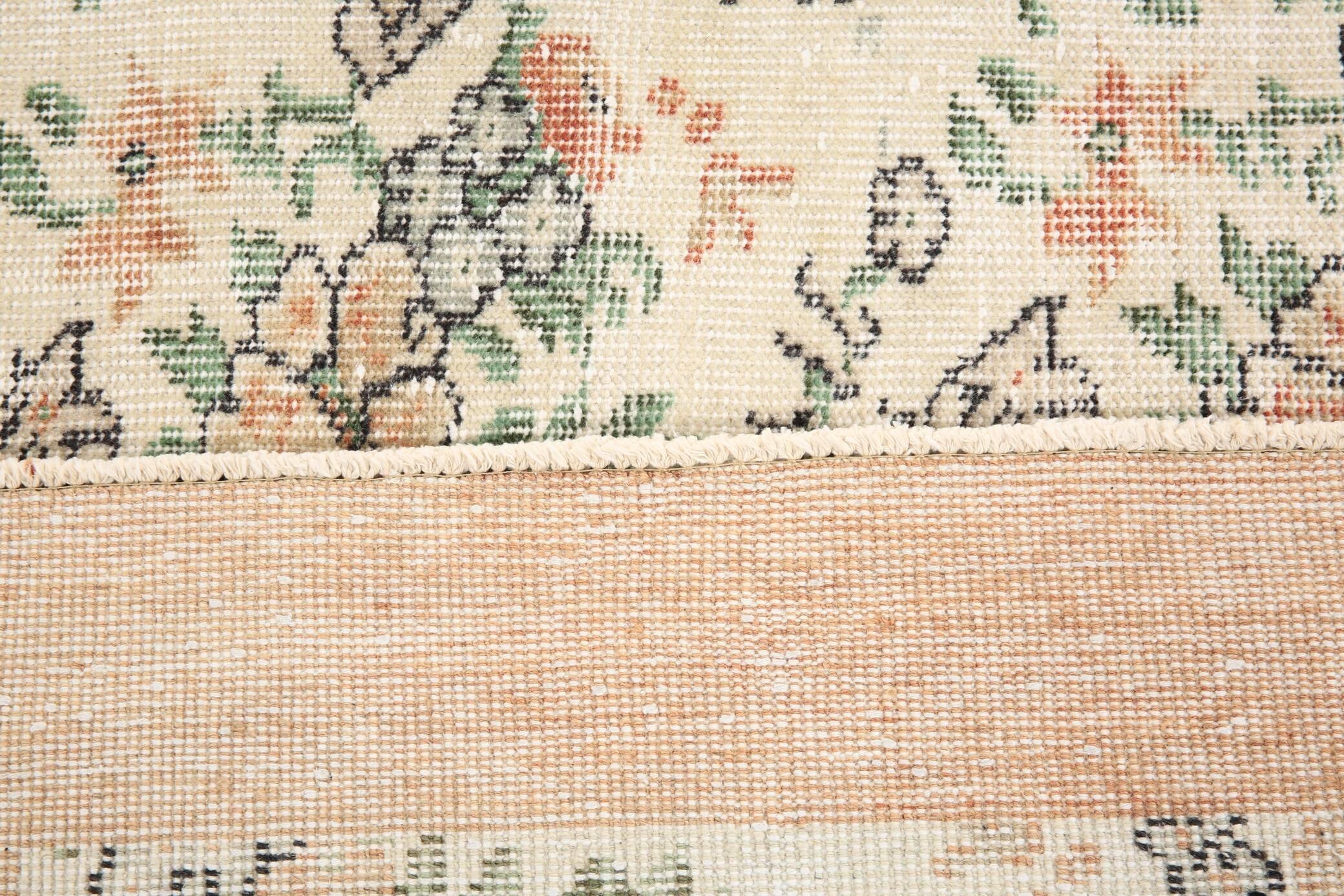 Tapis en laine et coton à décor floral