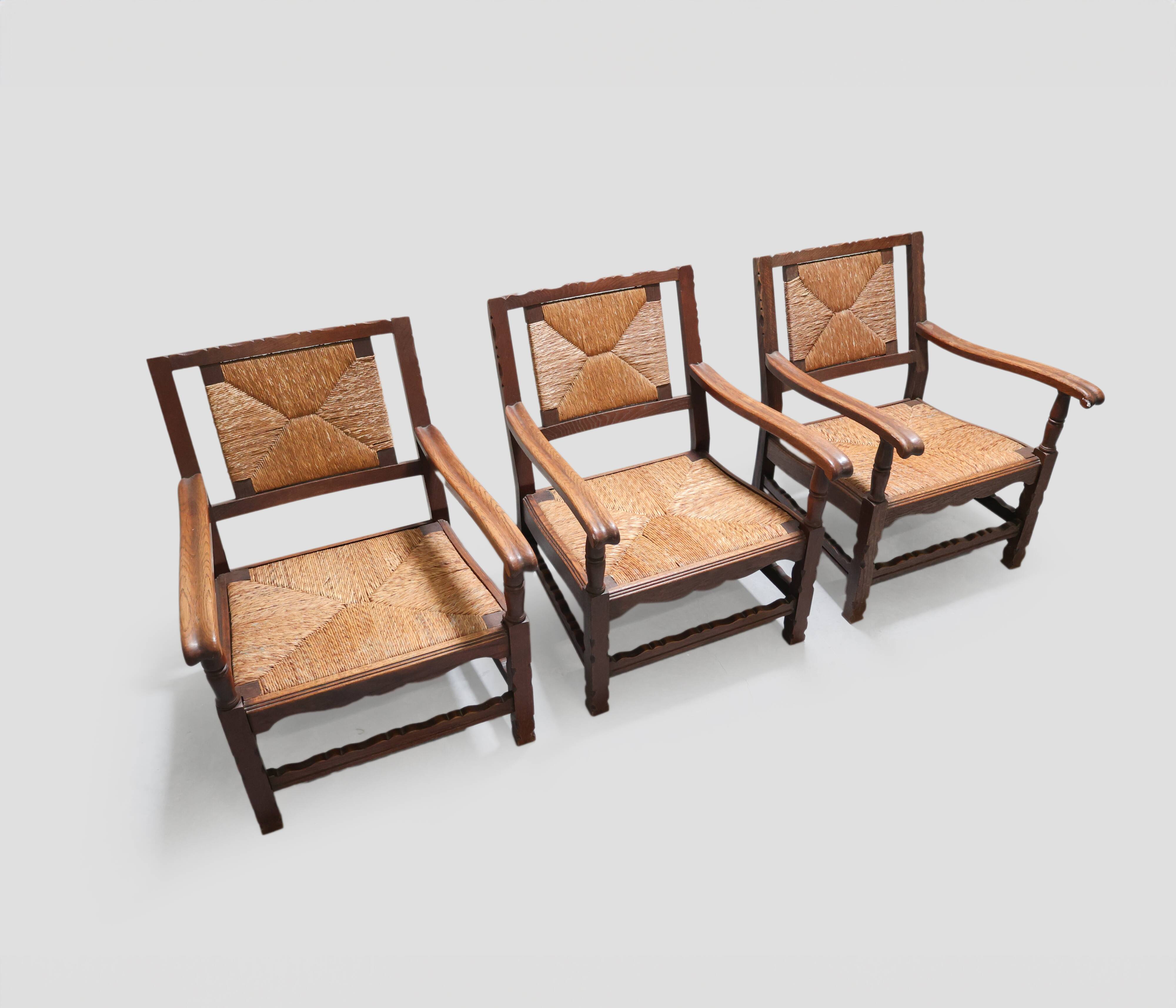 Mid-century rustic wooden armchairs with woven seat and back