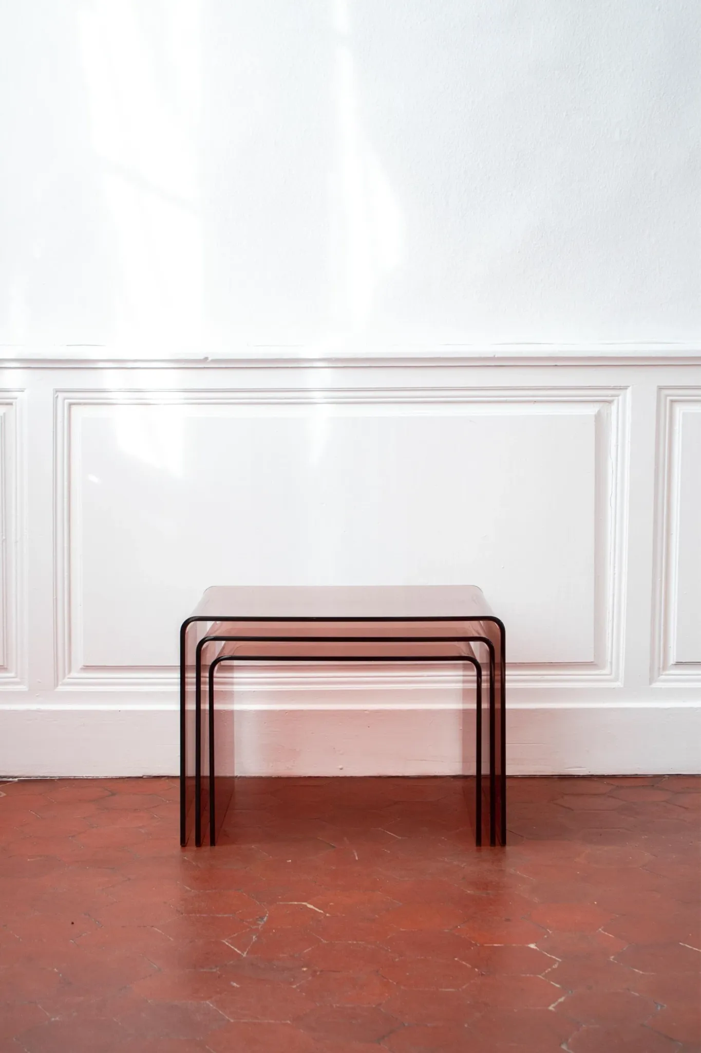 Vintage trio of nesting tables in smoked plexiglass by Michel Dumas, year
