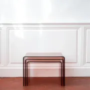 Vintage trio of nesting tables in smoked plexiglass by Michel Dumas, year